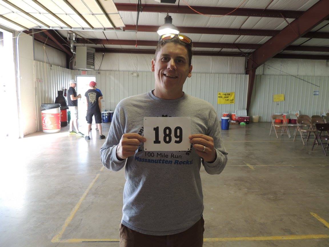 Brian Carr holds bib number 189 to the camera